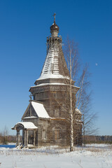 Ancient wooden Sreteno-Mikhailovskaya Church (1655) close-up on a frosty February day. Krasnaya Lyaga, Kargopol district. Arakhangelsk region, Russia