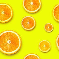 Ripe orange slices on a bright background. Seamless background.