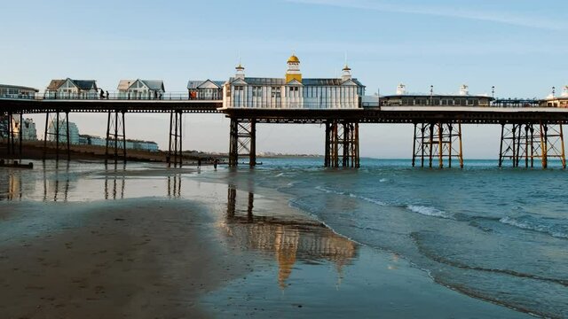 Wide view of the Eastbourne Pier in Eastbourne, East Sussex, England, a fashionable tourist seaside resort, east of Beachy Head
