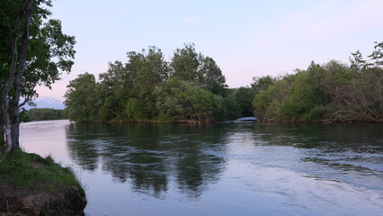 quiet river at sunset on a weekend