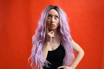 Fototapeta premium Portrait of caucasian cute model on red background