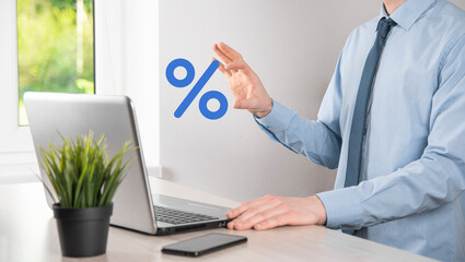 Businessman hand takes a percentage symbol icon. Interest rate financial and mortgage rates concept.
