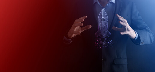 An empty workpiece. A businessman in a suit on a black background holds his hands protective gesture. A gesture of care and patronage.