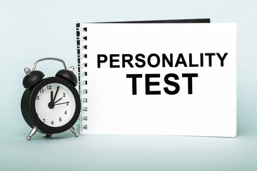 Personality test. Notebook with text , on blue background.