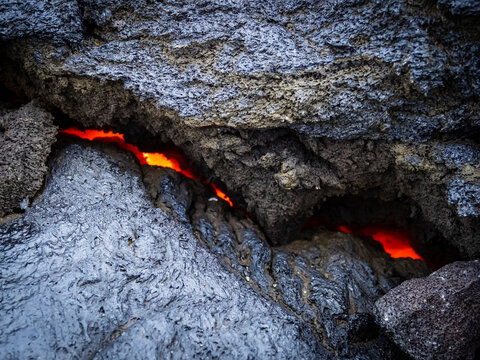 Hot magma visible underneath cooled lava crust, Fagradalsfjall volcano, Volcanic eruption at Geldingadalir, Iceland