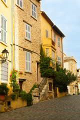 Narrow street in the historical part of town in France, Antibes. Popular travel destination for the...