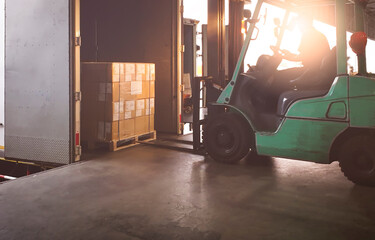 Forklift Tractor Loading Package Boxes into Cargo Container at Dock Warehouse. Delivery Service....