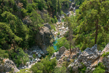 Fototapeta na wymiar A canyon with a hiking trail. Mountain river. Part of the Lycian trail through the mountain range.