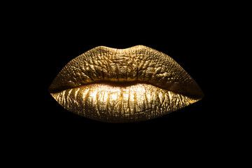 Closeup sexy beautiful female golden lips isolated. Gold lipstick. Gold lips. Gold Paint from the lips. Golden lips on beautiful model girls mouth.