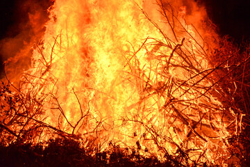 Close up of bonfire and hot orange embers in rural Minnesota, USA
