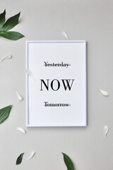 A white frame with the inscription: yesterday, tomorrow, now. A person's choice of the present moment. The value of the moment now
 - obrazy, fototapety, plakaty