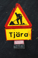 Roadwork tar warning sign