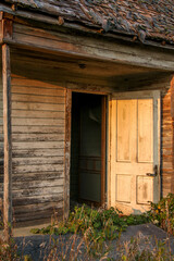 Door of old one room schoolhouse at sunset in rural Minnesota, USA.
