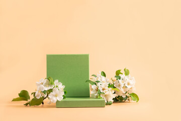 Modern abstract podium green paper geometric shapes white flowers pastel pink background. Copy...
