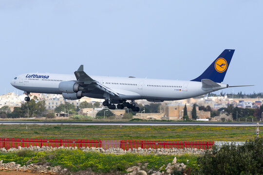 Luqa, Malta - January 12, 2016: Lufthansa Airbus A340-642 [D-AIHR] arriving for servicing at Lufthansa Technik Malta.