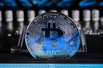 Cryptocurrency bitcoin coins on circuit board