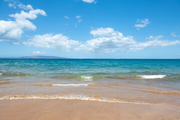Blue ocean wave on sandy beach. Beach in sunset summer time. Beach landscape. Tropical seascape, calmness, tranquil relaxing sunlight.