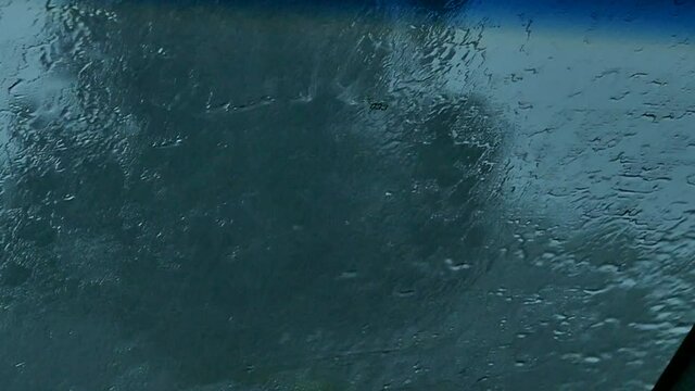 Slow motion and rain on car window with swiping vipers 2