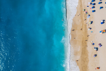Aerial drone bird's eye view photo of most popular beach of Milos with turquoise clear waters and...