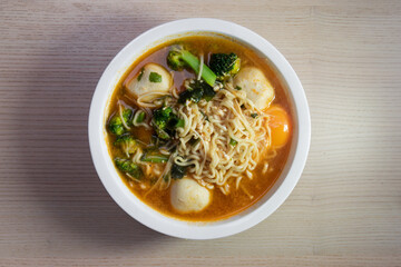 A bowl of spicy noodle soup.