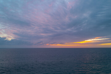 Sunrise over the sea and beautiful cloudscape. Colorful ocean beach sunset.