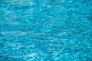 Tansparent clear calm water surface texture. Abstract nature background. Sea water pattern.