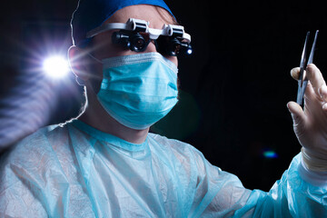 concept of neurosurgery doctor in dark operating room.