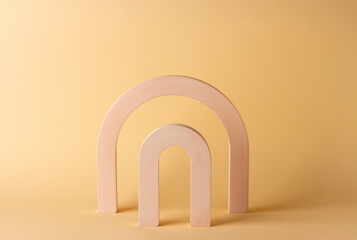 Composition with concrete arches in the style of minimalism on a delicate background