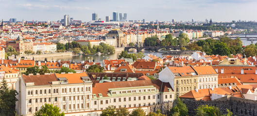 Naklejka na ściany i meble Panoramic view over the river Moldau (Vltava) and historic buildings in Prague, Czech Republic
