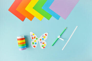 A paper butterfly made of colored paper. LGBT Characters Step-by-step instructions. Step 2. Glue...