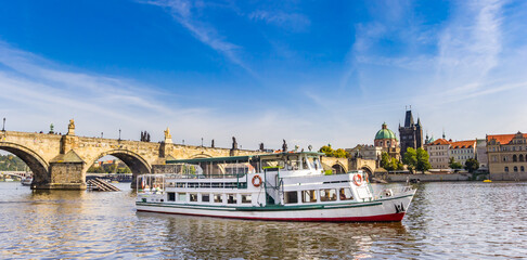 Panorama of a tourist boat on the river Vltava in Prague, Czech Republic