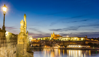 Fototapeta na wymiar Night view of the Charles bridge over the river Moldau in Prague, Czech Republic