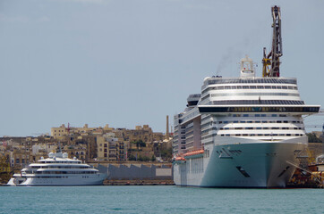 Dry Dock maintenance work on luxury MSC cruiseships Divina and cruise ship liner Magnifica at pier...