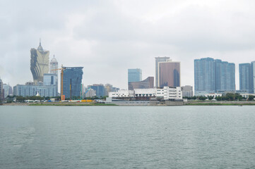 Fototapeta na wymiar View landscape cityscape modern building and seascape south china sea for Macanese people foreign traveler walking travel visit at Macao Special Administrative Region on April 19, 2015 in Macau, China