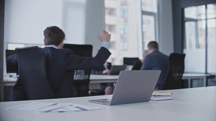 Excited employee happy with good news on laptop, successful deal, promotion