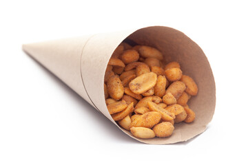 Close-up of Heeng jeera Peanuts mixture Indian namkeen (snacks) In handmade ( handcraft ) brown paper cone bag over white background.