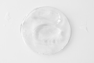 Plastic can with transparent gel or cream for body, as texture or background. Top view.