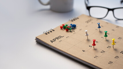 Close up of calendar on the table, planning for business meeting or travel planning concept.	