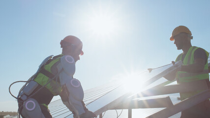Men installing photovoltaic panel together