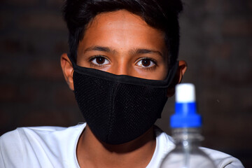 boy with alcohol gel or antibacterial soap sanitizer.Hygiene concept. prevent the spread of germs...
