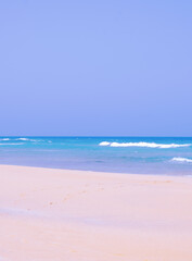 Obraz premium Ocean shore and desert background. Ideal for postcard prints, phone cases, print t-shirts. Canary islands. Fuerteventura. Stylish nature visual spirits minimalist wallpaper
