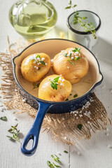 Homemade Hasselback with herbs and oil. Swedish cuisine.