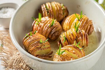 Tasty baked potatoes with herbs and oil. Scandinavian cuisine.