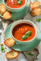 Homemade tomato soup made of tasty tomatoes. Soup with parmesan