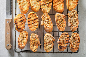 Toasted wholegrain bread on a cooling sheet