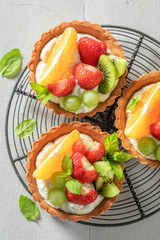 Homemade mini tart with various fruits. Sweet fruit dessert.