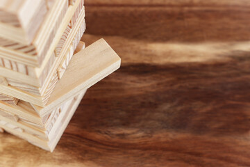 Concept image of wooden block stack, risk and management idea