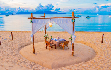 Romantic private dinner on honeymoon on Koh Samui beach Thailand.