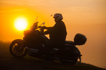 Obraz na płótnie Canvas silhouette of a person on a motorcycle