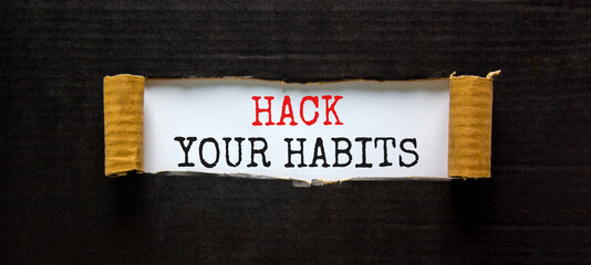 Hack your habits symbol. Words 'Hack your habits' appearing behind torn black paper. Beautiful black background. Business, psychology and hack your habits concept, copy space.
